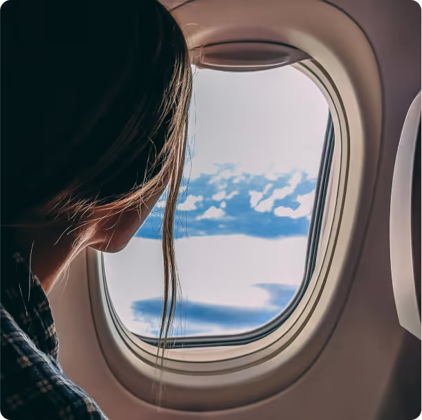A person looking outside of a window